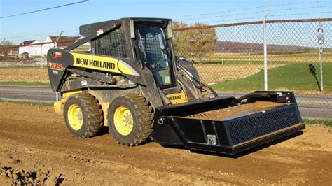 how to use a power rake on a skid steer|best skid steer power rake.